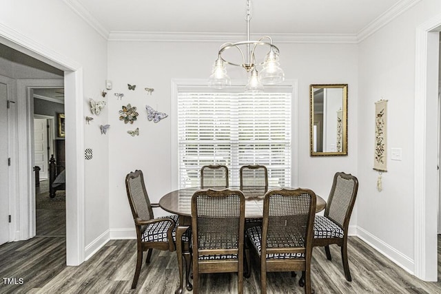 dining room featuring dark wood-type flooring, baseboards, an inviting chandelier, and ornamental molding