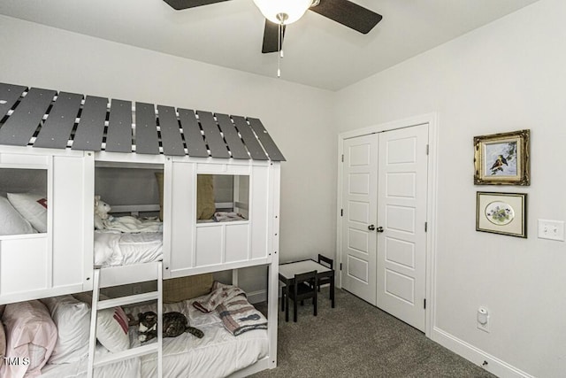 bedroom featuring a closet, baseboards, and carpet