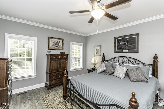 bedroom with visible vents, baseboards, ornamental molding, a ceiling fan, and wood finished floors