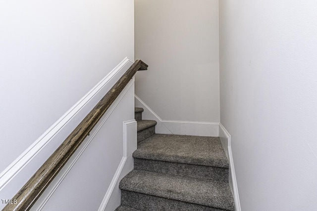 staircase with baseboards