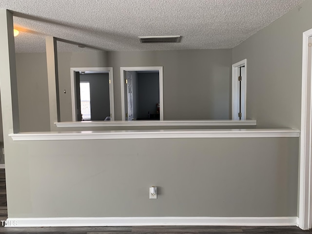 spare room with a textured ceiling and visible vents