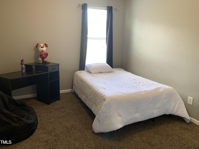 bedroom with carpet and baseboards