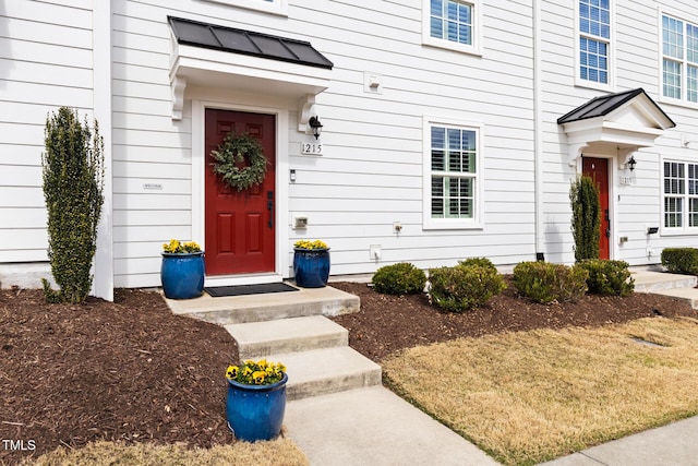 view of exterior entry featuring metal roof and a standing seam roof