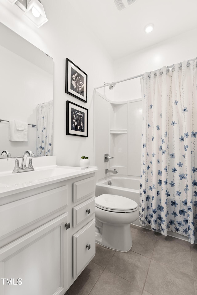 bathroom with tile patterned flooring, vanity, toilet, and shower / bath combo with shower curtain