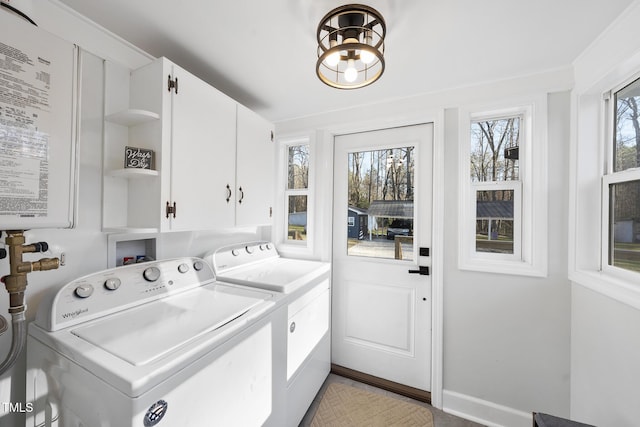 352 Leonard Rd, Louisburg, NC 27549 - clothes washing area with washing machine and dryer, cabinet space, and baseboards