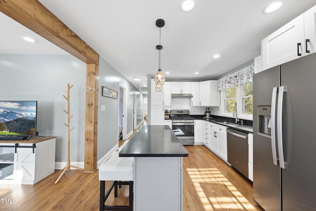 352 Leonard Rd, Louisburg, NC 27549 - kitchen with light wood finished floors, white cabinets, appliances with stainless steel finishes, and a sink