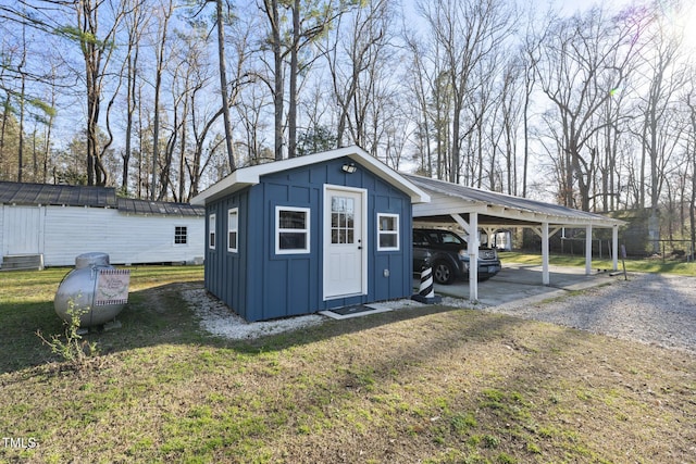 352 Leonard Rd, Louisburg, NC 27549 - view of outdoor structure with an outbuilding, gravel driveway, and a carport