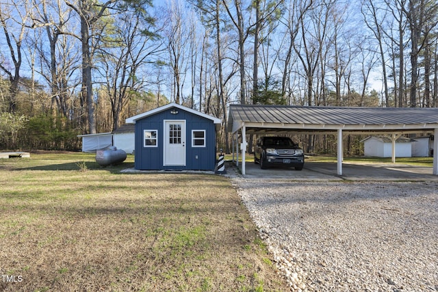 352 Leonard Rd, Louisburg, NC 27549 - view of shed with a detached carport and driveway