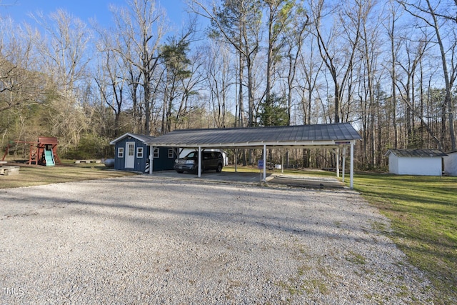 352 Leonard Rd, Louisburg, NC 27549 - view of parking / parking lot featuring playground community, driveway, and a shed