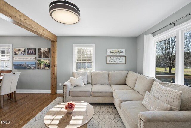 352 Leonard Rd, Louisburg, NC 27549 - living area featuring beamed ceiling, baseboards, and wood finished floors