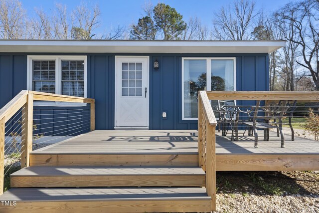 352 Leonard Rd, Louisburg, NC 27549 - property entrance with a deck and board and batten siding