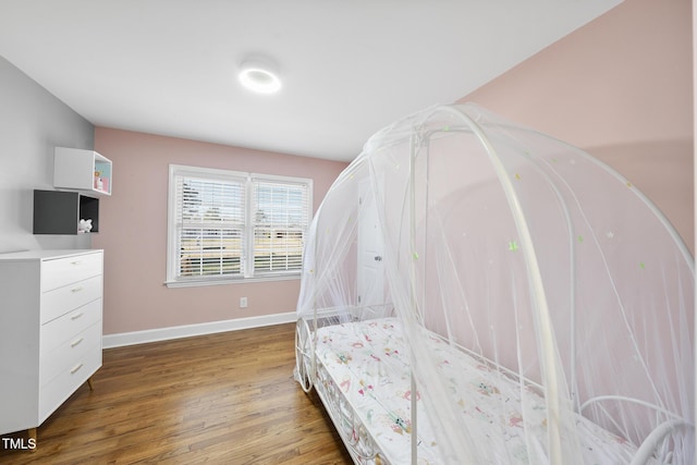 352 Leonard Rd, Louisburg, NC 27549 - bedroom featuring wood finished floors and baseboards