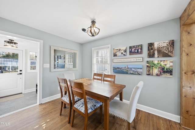352 Leonard Rd, Louisburg, NC 27549 - dining room featuring baseboards, an inviting chandelier, and wood finished floors
