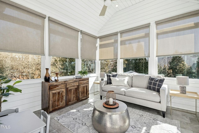 sunroom / solarium featuring lofted ceiling, ceiling fan, and wood ceiling