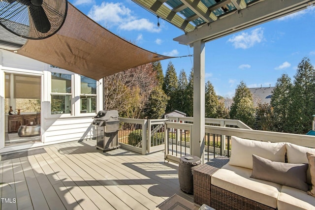 wooden terrace featuring outdoor lounge area and grilling area