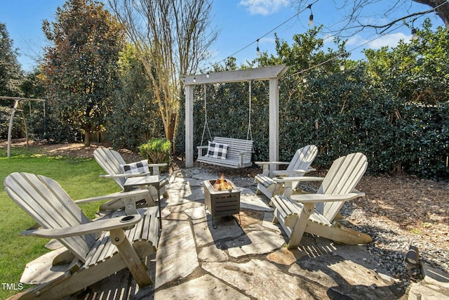 view of patio featuring an outdoor fire pit