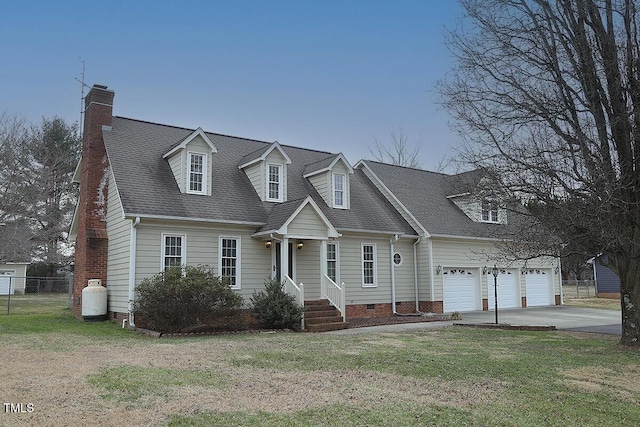 new england style home featuring concrete driveway, a front lawn, crawl space, and fence