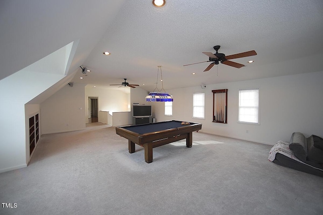 rec room featuring lofted ceiling, light carpet, a textured ceiling, and recessed lighting