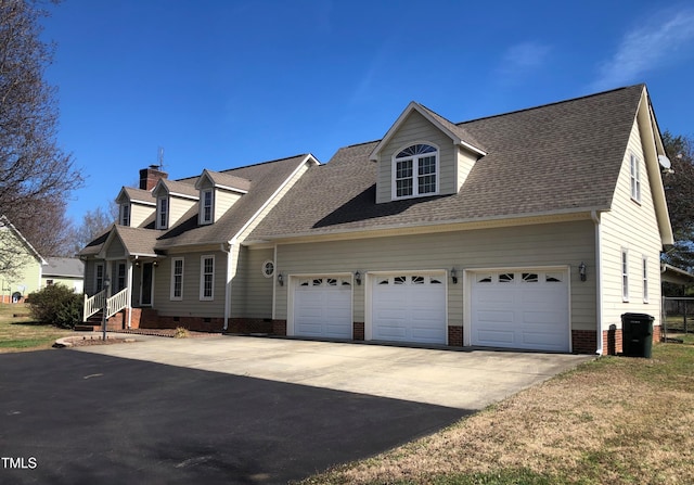 cape cod house with crawl space, a shingled roof, a garage, and concrete driveway