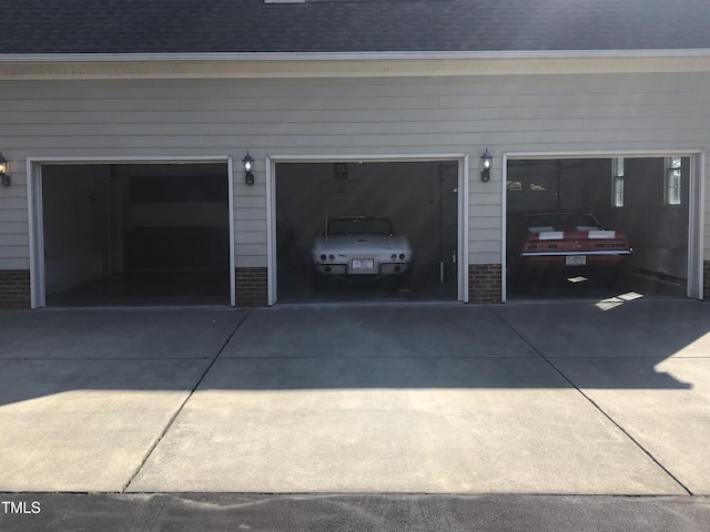 garage featuring driveway