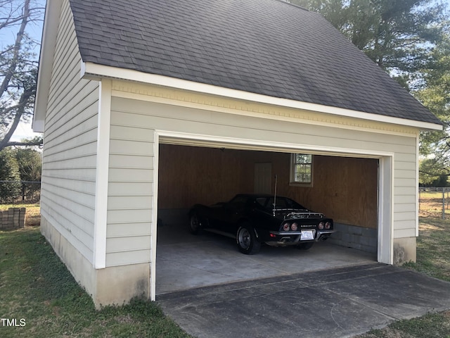 garage with fence