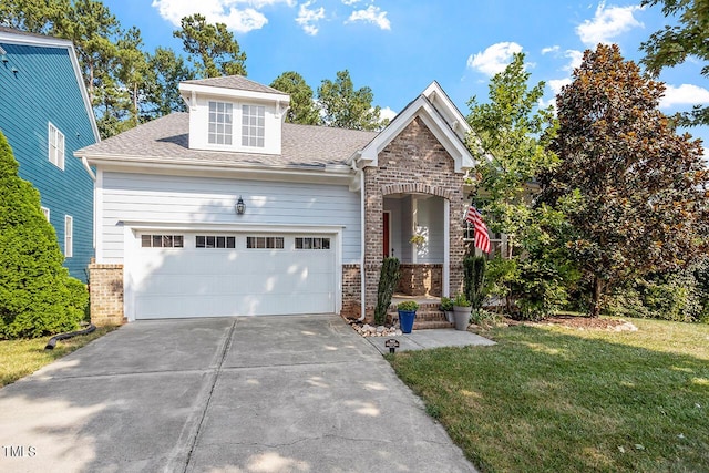 view of front of property with brick siding, roof with shingles, an attached garage, driveway, and a front lawn