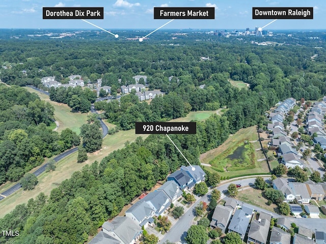 aerial view featuring a residential view and a view of trees