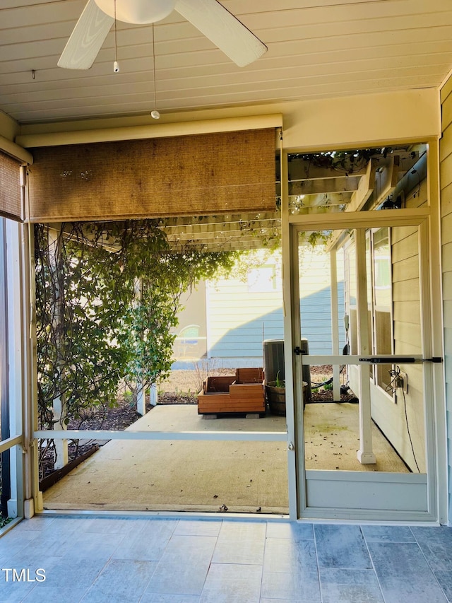 exterior space featuring ceiling fan