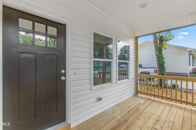 entrance to property featuring covered porch