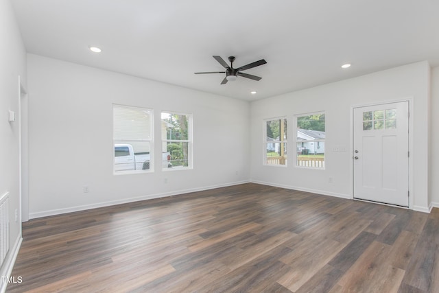 unfurnished living room featuring recessed lighting, dark wood-style flooring, ceiling fan, and baseboards