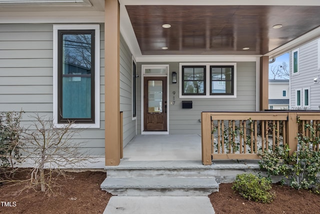 property entrance featuring covered porch