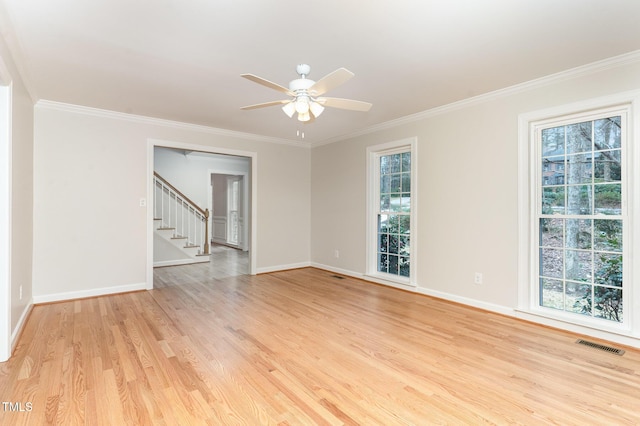 unfurnished room featuring stairway, baseboards, visible vents, light wood-style flooring, and ornamental molding