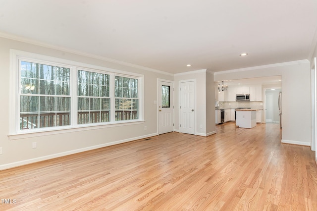 unfurnished living room featuring recessed lighting, baseboards, light wood-style floors, and crown molding