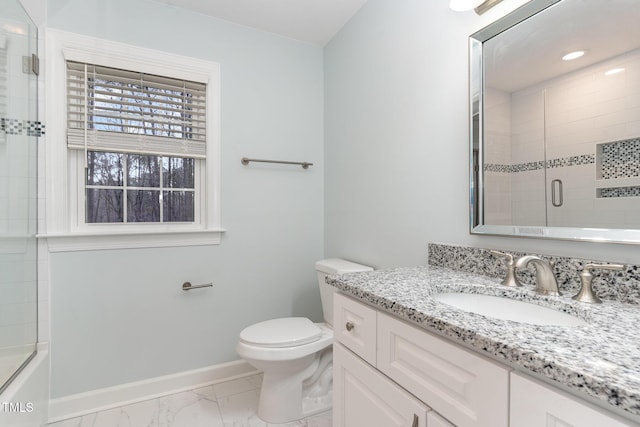 bathroom featuring marble finish floor, toilet, vanity, and baseboards