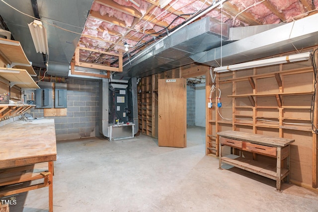 unfinished basement with electric panel and heating unit