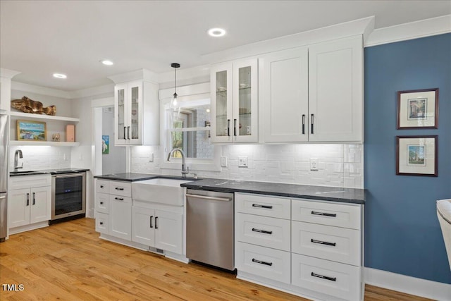 kitchen featuring beverage cooler, white cabinets, appliances with stainless steel finishes, open shelves, and glass insert cabinets