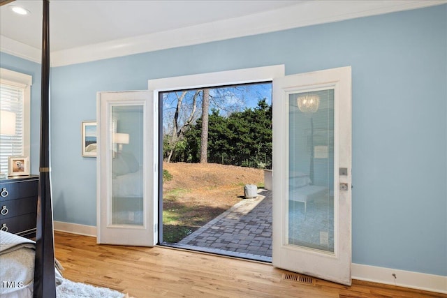 entryway with light wood-type flooring, visible vents, baseboards, and recessed lighting