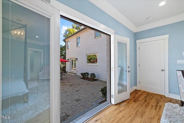 entryway with light wood-style floors and baseboards