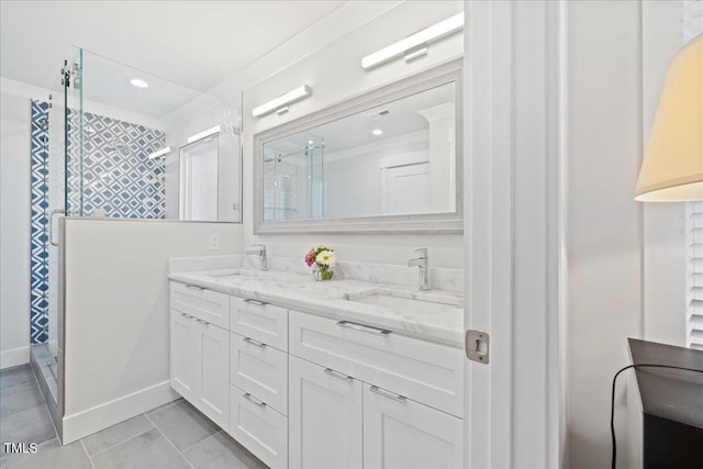 bathroom featuring a stall shower, a sink, recessed lighting, and double vanity