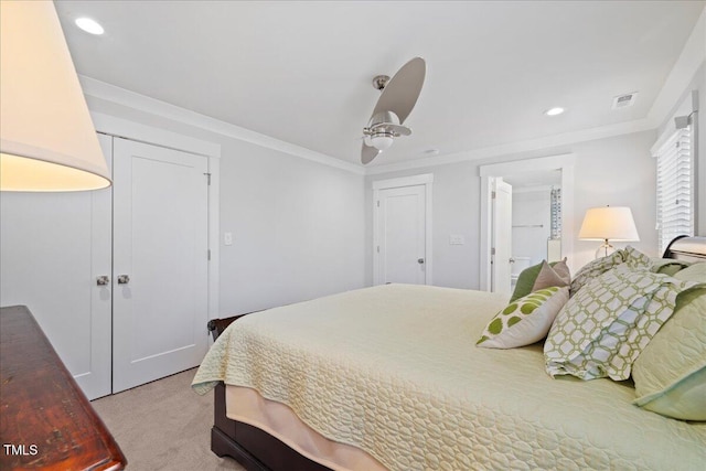 bedroom featuring crown molding, recessed lighting, a closet, visible vents, and light carpet