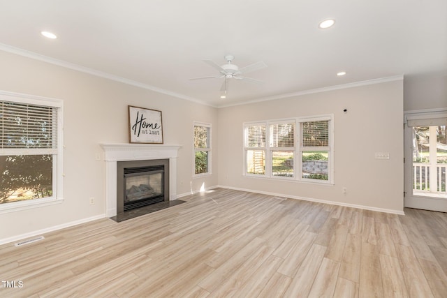 unfurnished living room featuring a fireplace with flush hearth, visible vents, wood finished floors, and ornamental molding