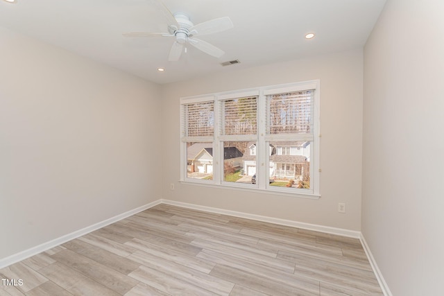 empty room featuring recessed lighting, visible vents, light wood-style floors, a ceiling fan, and baseboards