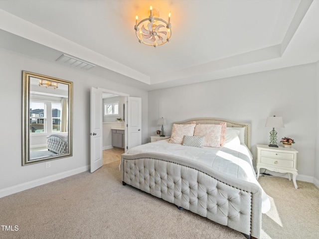 bedroom with carpet, a raised ceiling, visible vents, a chandelier, and baseboards