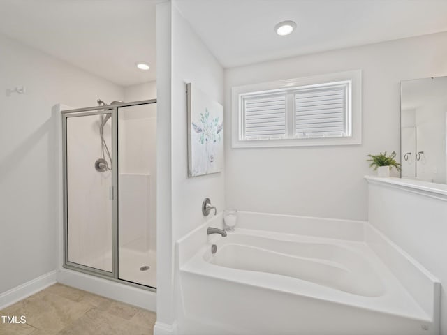 full bathroom featuring a stall shower, a bath, and recessed lighting