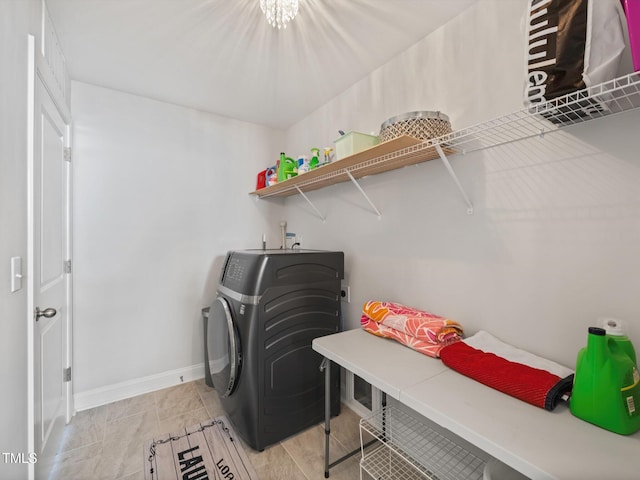 laundry room featuring washer / dryer, laundry area, and baseboards