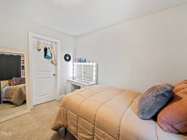 bedroom featuring light carpet