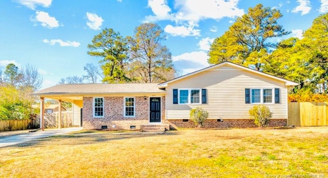 view of front of property with an attached carport, fence, driveway, crawl space, and a front yard