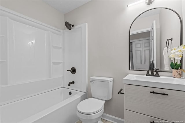full bathroom featuring toilet, bathtub / shower combination, vanity, and baseboards
