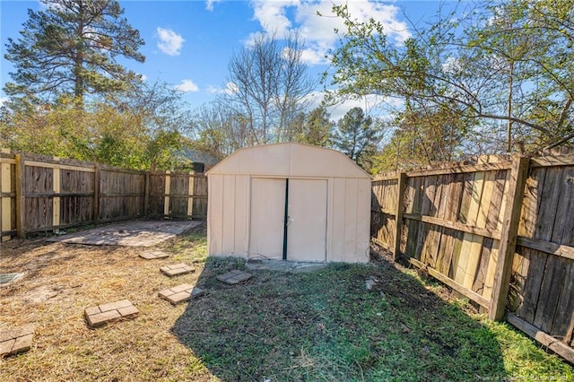 view of shed featuring a fenced backyard