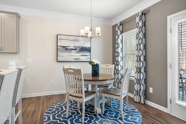 dining space featuring an inviting chandelier, baseboards, ornamental molding, and dark wood-type flooring